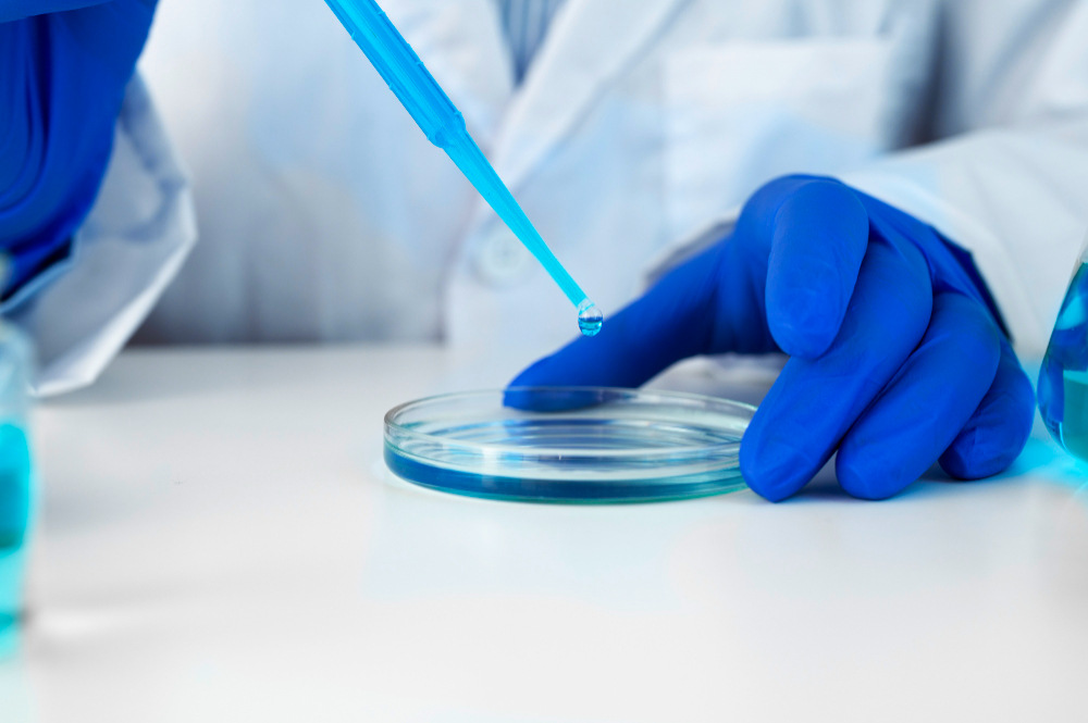 Laboratory technician conducting sugar testing in Qatar for beverage compliance and food safety analysis.