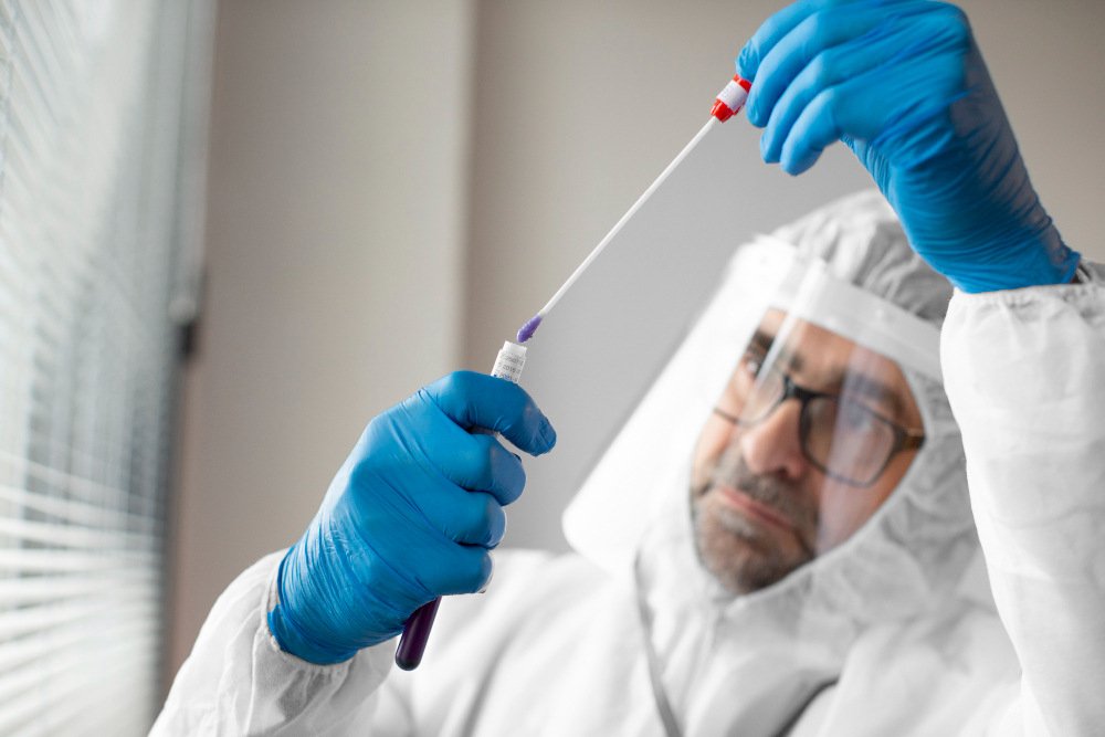 Laboratory professional conducting virus testing in Qatar