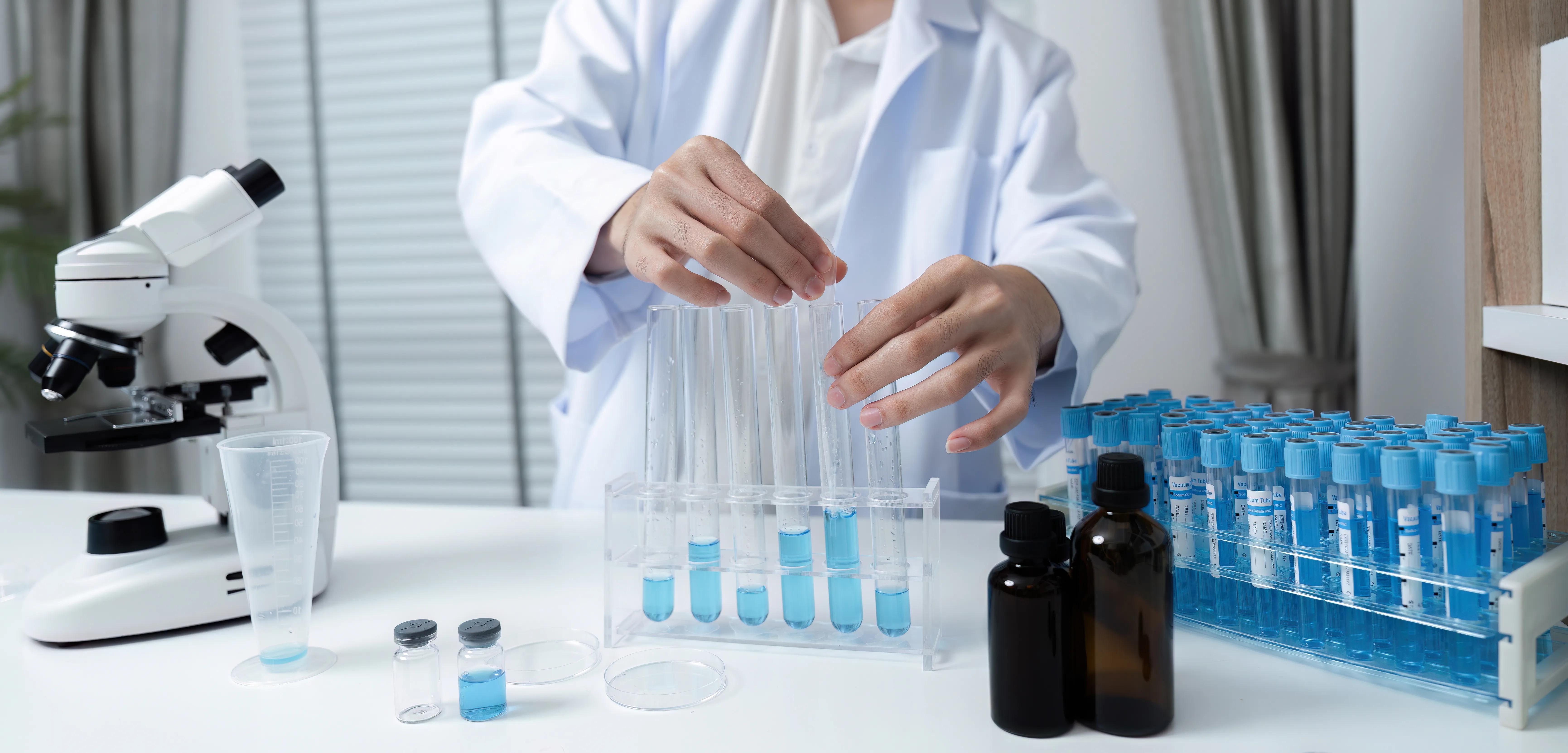 scientist pouring water into beaker