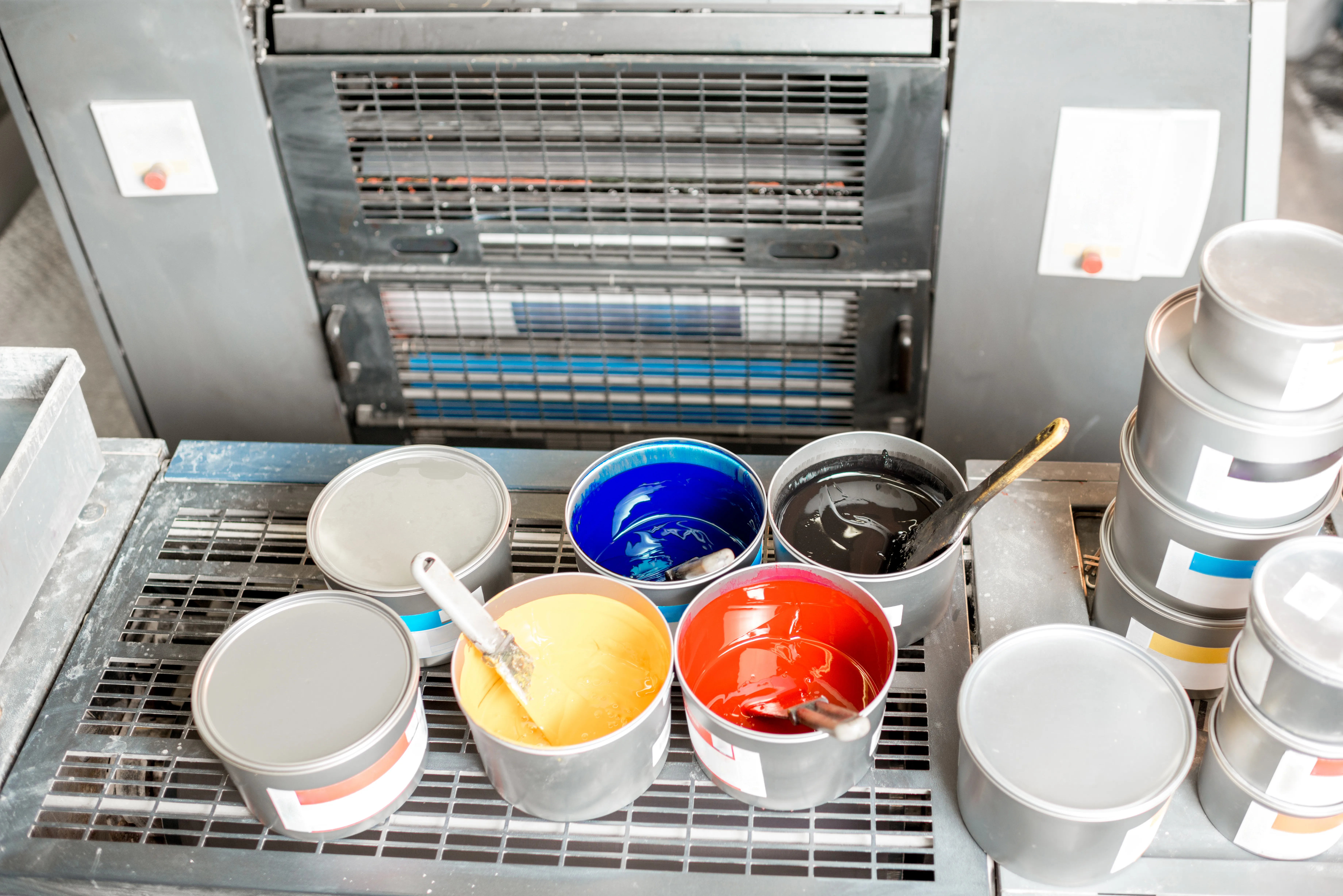 gloved hand holding test tube by river