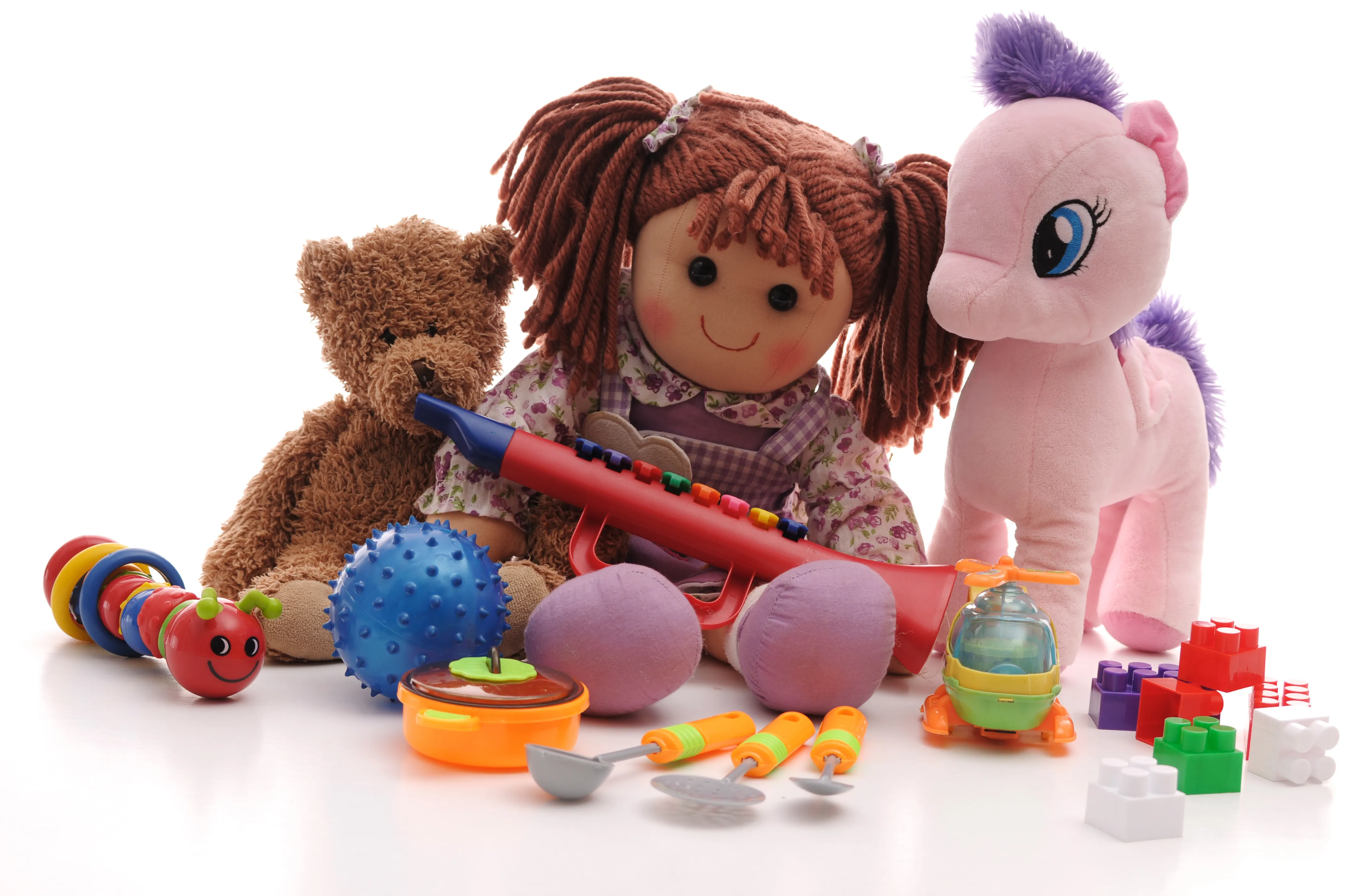 gloved hand holding test tube by river